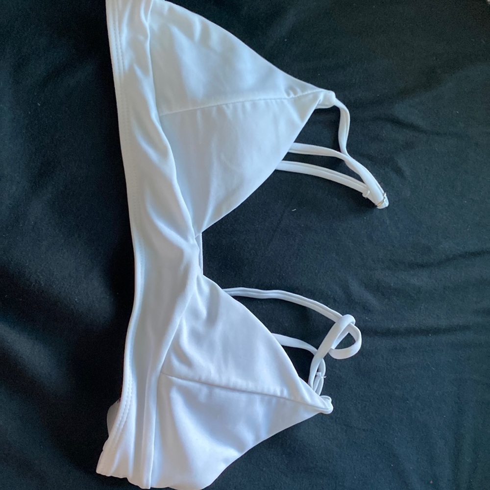 This is a Shein white triangle swimsuit top. Size small.